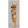 Image 4 : An ivory netsuke of a foreigner carring Tama.