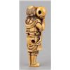 Image 5 : An ivory netsuke of a foreigner carring Tama.