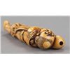 Image 8 : An ivory netsuke of a foreigner carring Tama.