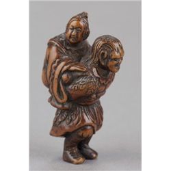 A wood netsuke of a Tekkai Sennin.