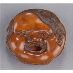 A wood netsuke of Okame and Usofuki.
