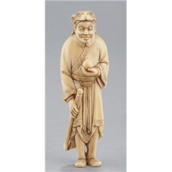 An ivory netsuke ofChinese hunter with deer disgui