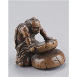 A wood netsuke of Nio.