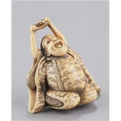 An ivory netsuke of Daruma.