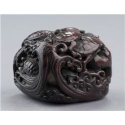 A hardwood netsuke of turtle group.