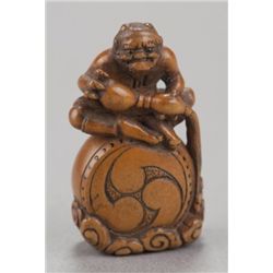 A boxwood netsuke of Raiden.