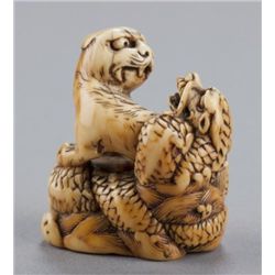 An ivory netsuke of tiger and dragon, U-chu no Tor