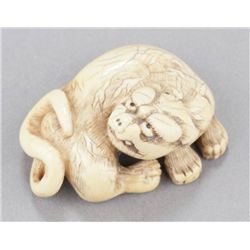 An ivory netsuke of a tiger.