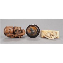 A group of three netsuke of tigers.