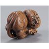 Image 3 : A group of three netsuke of tigers.