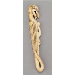 An ivory sashi netsuke of a dragon.