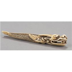 An ivory sashi netsuke dragon fish.