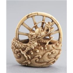 An ivory manju of a dragon.