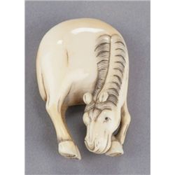 An ivory netsuke of a horse.