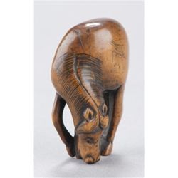 A wood netsuke of a horse.