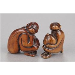 Group of two wood netsuke of monkeys.