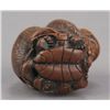 Image 5 : A boxwood netsuke of a monkey atop a tortoise.