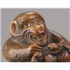 Image 7 : A boxwood netsuke of a monkey atop a tortoise.