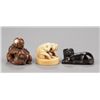 Image 1 : A group of three netsuke of dogs, various material