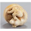 Image 7 : A group of three netsuke of dogs, various material