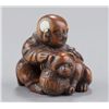 Image 8 : A group of three netsuke of dogs, various material