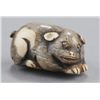 Image 2 : A group of three ivory netsuke of dogs.