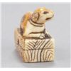 Image 8 : A group of three ivory netsuke of dogs.