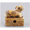 Image 9 : A group of three ivory netsuke of dogs.