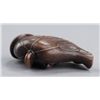 Image 6 : A wood netsuke of a lotus leaf.