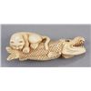 Image 1 : An ivory netsuke of a cat.