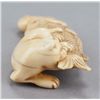 Image 3 : An ivory netsuke of a cat.