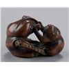 Image 1 : A wood netsuke of an octopus and monkey.
