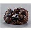 Image 3 : A wood netsuke of an octopus and monkey.
