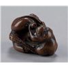 Image 5 : A wood netsuke of an octopus and monkey.