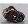 Image 6 : A wood netsuke of an octopus and monkey.