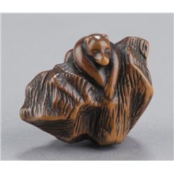 A wood netsuke of Kiubi no Kitsune.