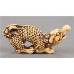 An Ivory netsuke of a baku.