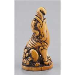 An ivory netsuke of a baku.