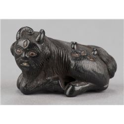 An ebony netsuke of a Kudan.