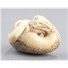 Image 7 : An ivory netsuke of a mermaid.