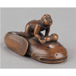A boxwood netsuke of Kadori Miojin.