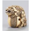 Image 2 : An ivory netsuke of a Shishi.