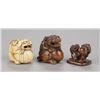 Image 1 : A group of three Shishi netsuke.