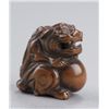 Image 7 : A group of three Shishi netsuke.