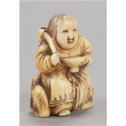 An ivory netsuke of Shojo.