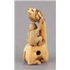 Image 3 : An ivory netsuke of a siniu and monkey.