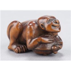 A boxwood netsuke, Bumbaku Chagama.