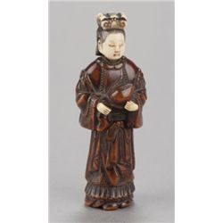 A wood with ivory netsuke of Seiobo.