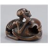 Image 1 : A wood netsuke of a skeleton.