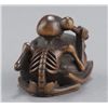 Image 5 : A wood netsuke of a skeleton.